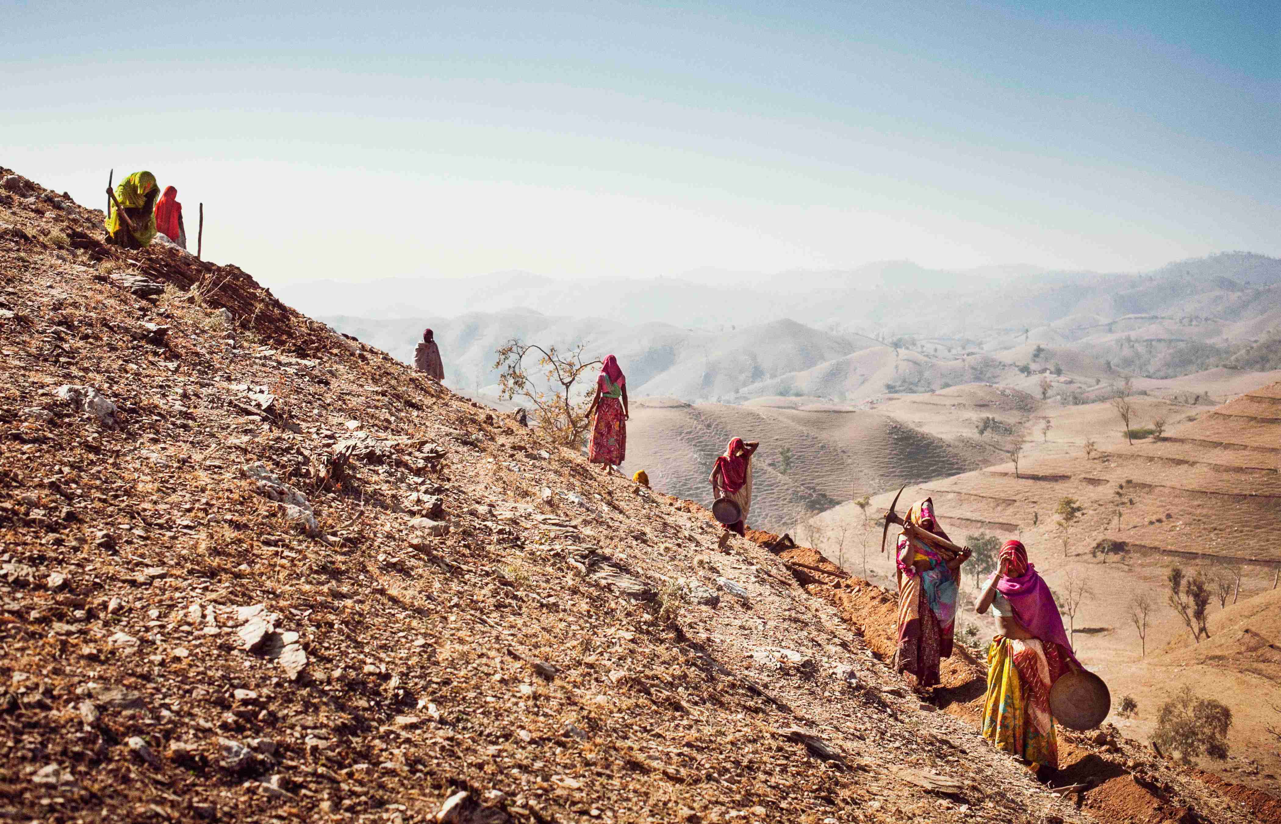 Community action Community members preparing a barren common land to be rejuvenated